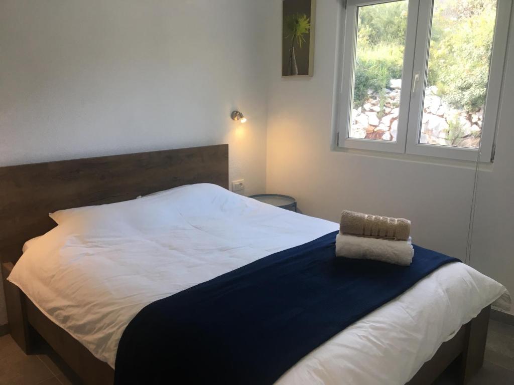 Postel nebo postele na pokoji v ubytování RIVA Seafront holiday apartments