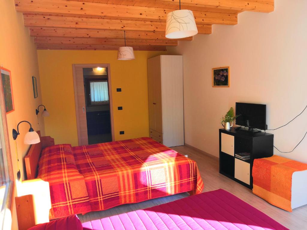 Postel nebo postele na pokoji v ubytování Agriturismo Val Codera