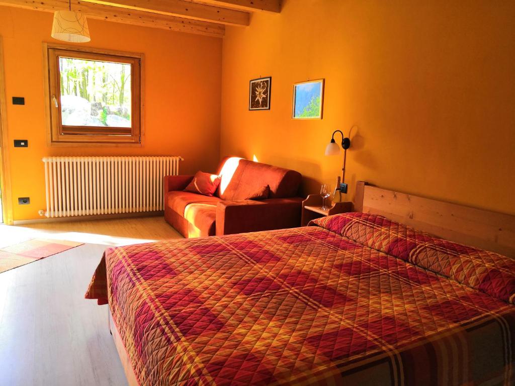 Postel nebo postele na pokoji v ubytování Agriturismo Val Codera