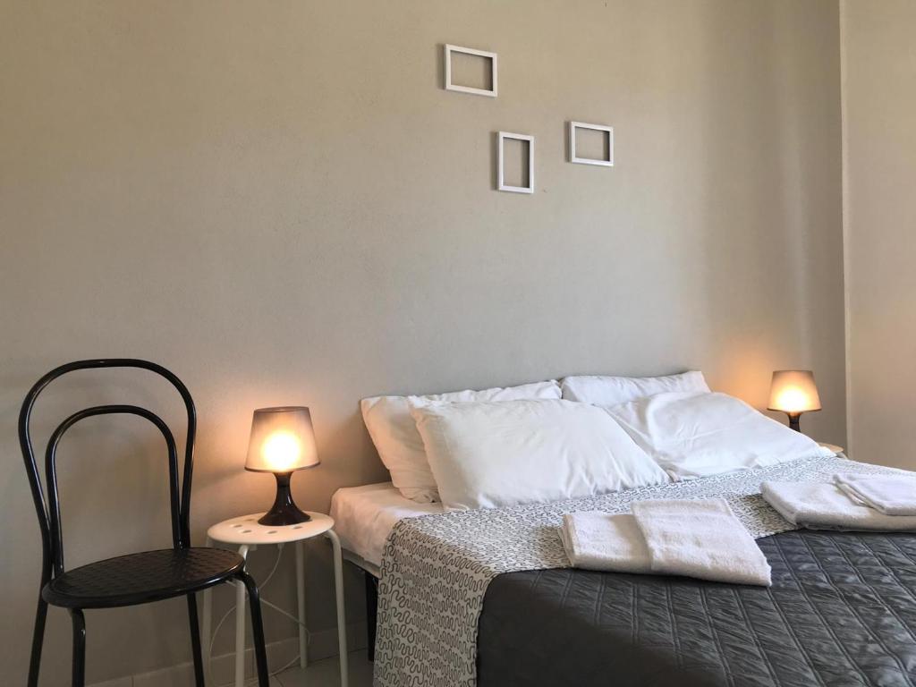 Posteľ alebo postele v izbe v ubytovaní Appartamenti Le Mimose