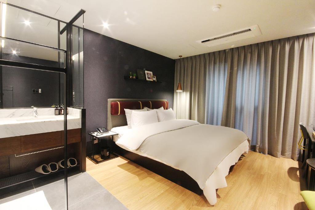 Brown Dot Hotel Seomyeonにあるベッド