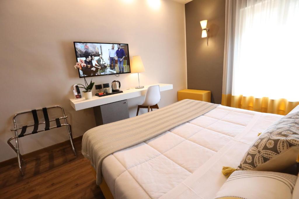 Postel nebo postele na pokoji v ubytování Hotel Umbria
