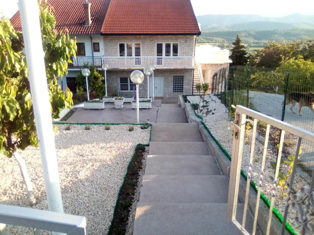 a stairway leading up to a house at Studio apartman Matković in Imotski