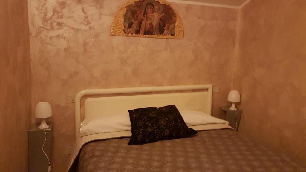 Кровать или кровати в номере La casetta dei Desideri