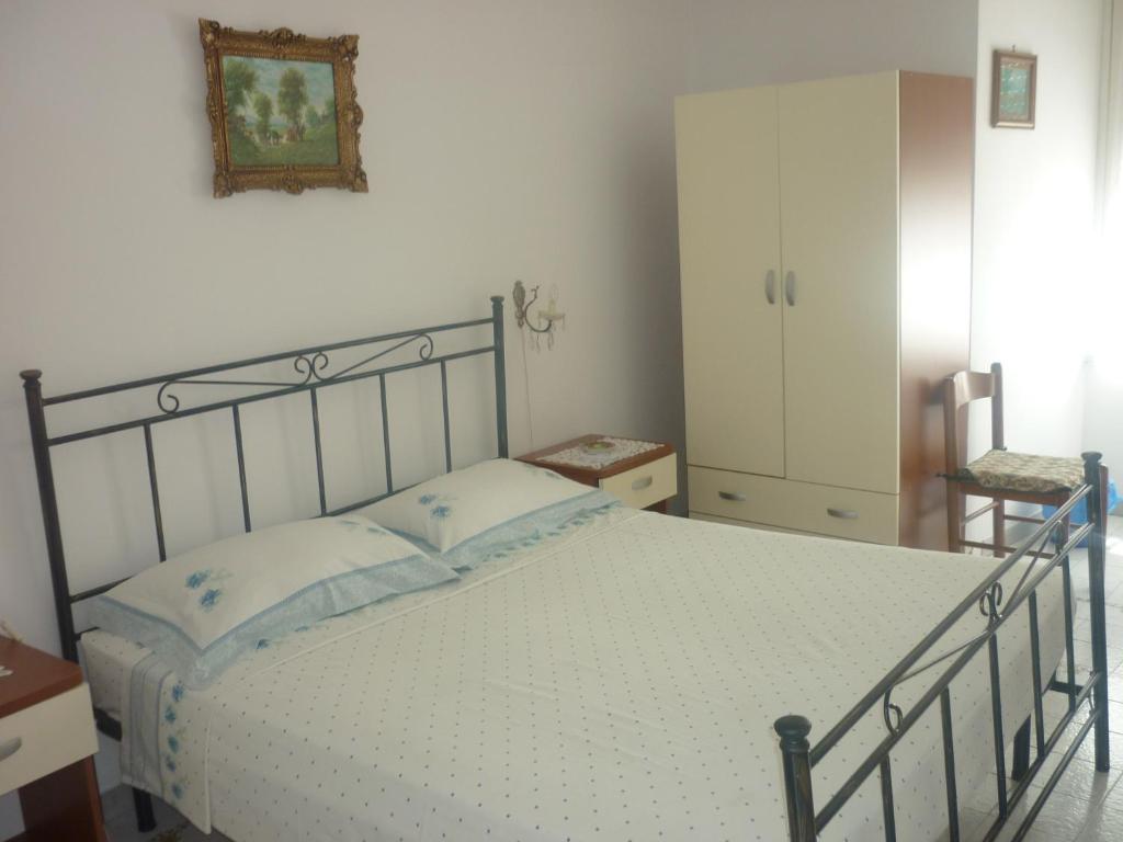 Postel nebo postele na pokoji v ubytování Albergo Vittoria