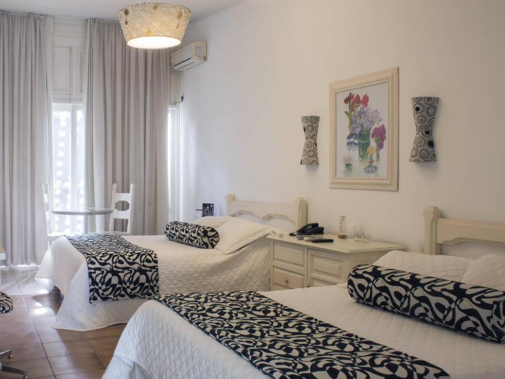 Postel nebo postele na pokoji v ubytování Hotel Resort e Golfe Clube dos 500