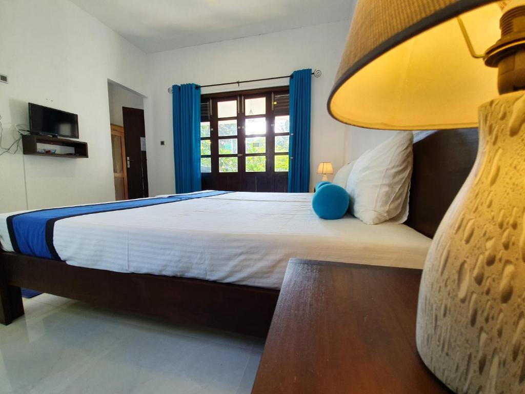 Postel nebo postele na pokoji v ubytování Coastal Villa Mirissa