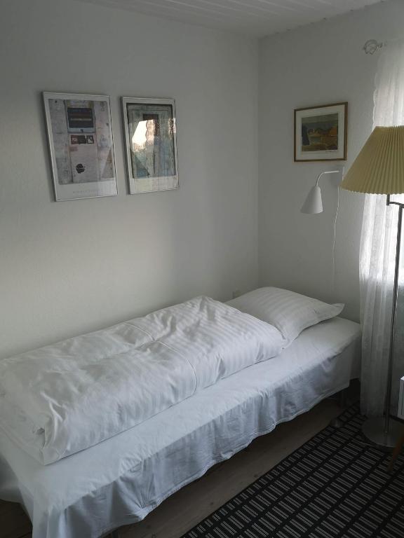 Postel nebo postele na pokoji v ubytování Rosenhuset