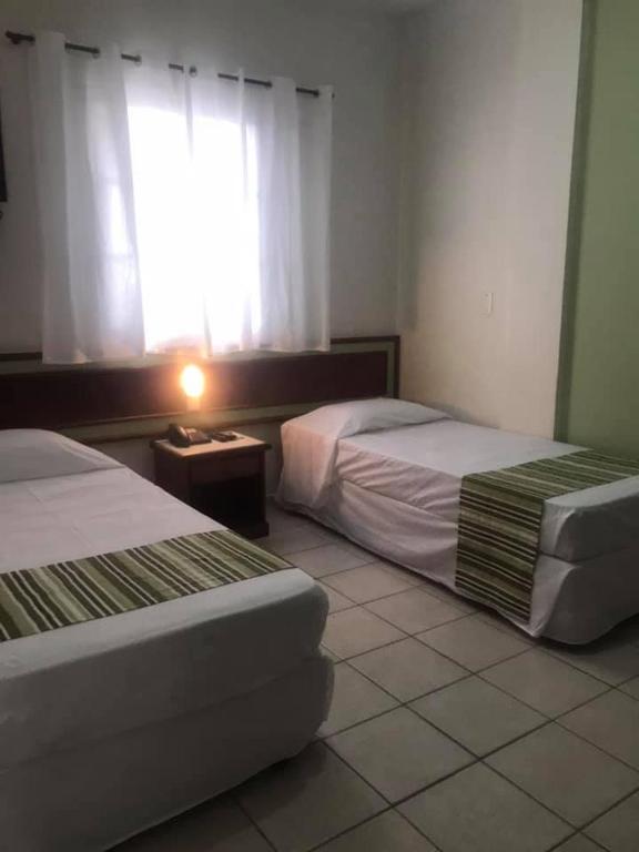 Postel nebo postele na pokoji v ubytování Princetel Palace Hotel