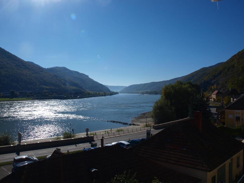 a view of a river with mountains in the background at Haus Nothnagl in Spitz