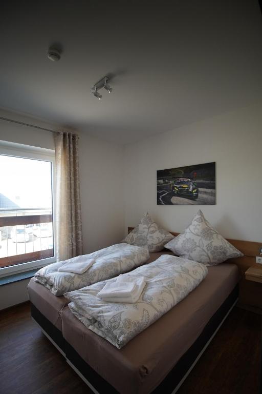 Postel nebo postele na pokoji v ubytování Nürburgring Aparts