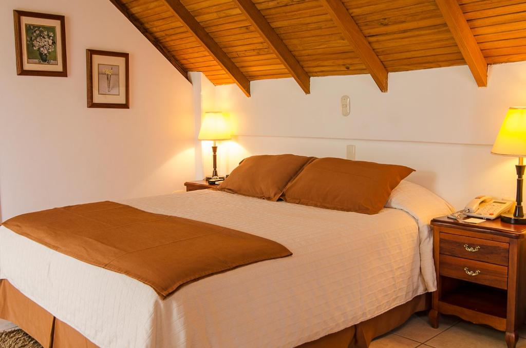 Postel nebo postele na pokoji v ubytování Hotel Balandra
