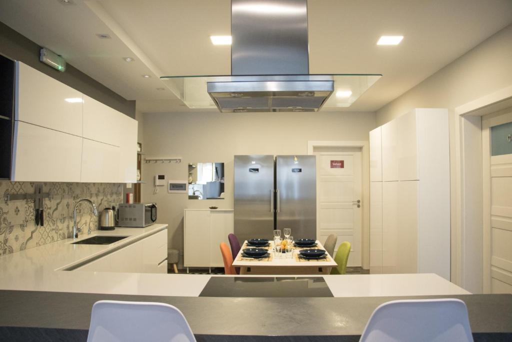 Kuchyň nebo kuchyňský kout v ubytování Sunshine Suites