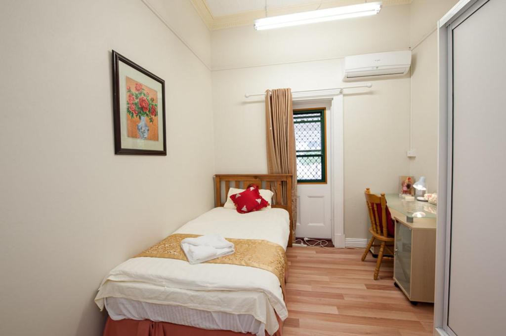 Postel nebo postele na pokoji v ubytování Pure Land Guest House