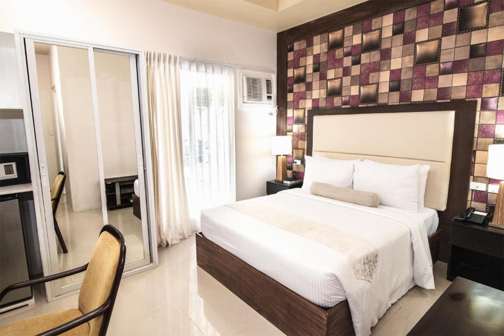 Postel nebo postele na pokoji v ubytování Sierra Hotel