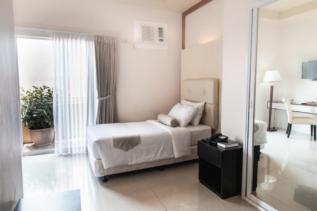 Postel nebo postele na pokoji v ubytování Sierra Hotel