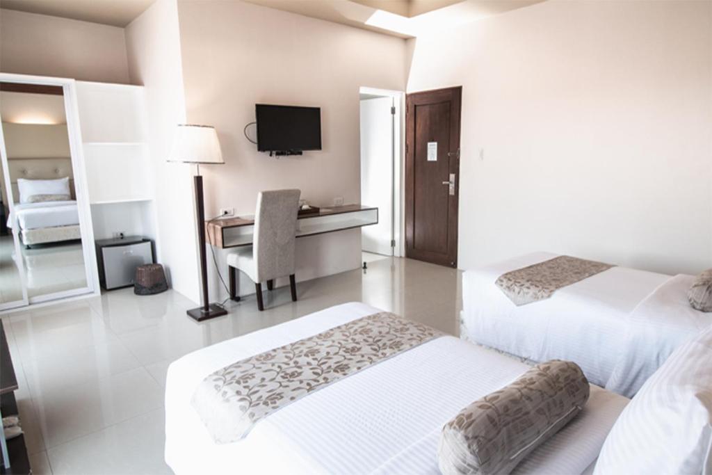 Postel nebo postele na pokoji v ubytování Sierra Hotel
