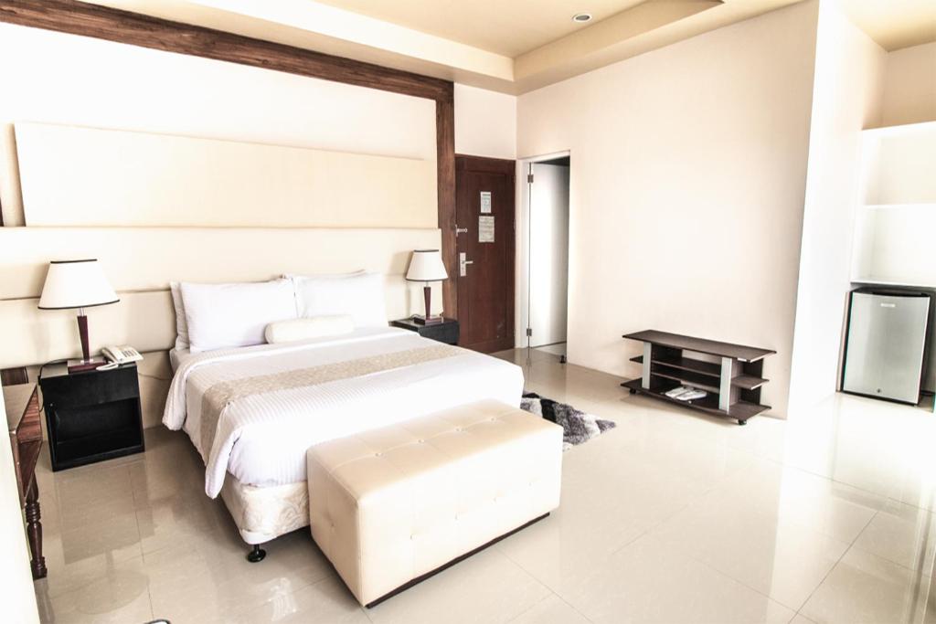 Postel nebo postele na pokoji v ubytování Sierra Hotel