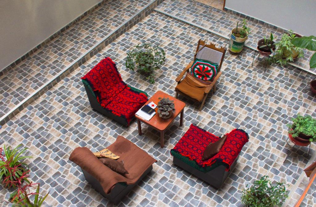 an overhead view of a patio with chairs and tables at Hostal El Gran Gocta in Chachapoyas