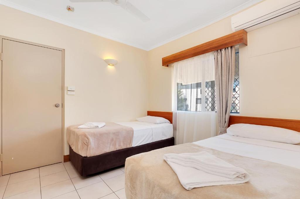 Postel nebo postele na pokoji v ubytování Tropical Queenslander