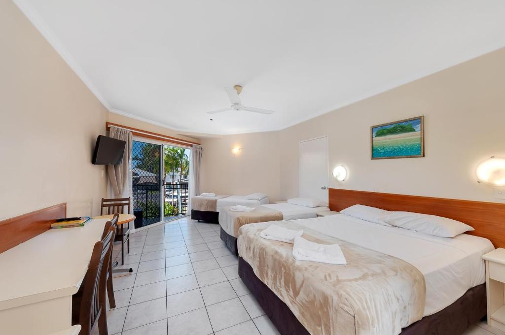 Postel nebo postele na pokoji v ubytování Tropical Queenslander
