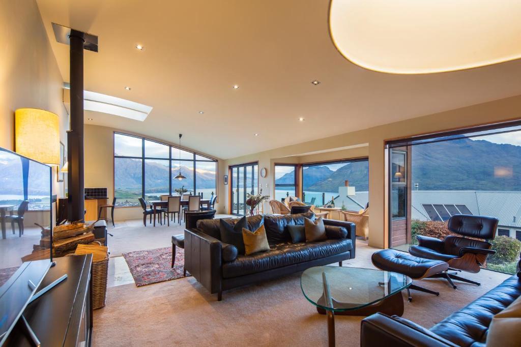 a living room with a couch and a television at London Lane in Queenstown