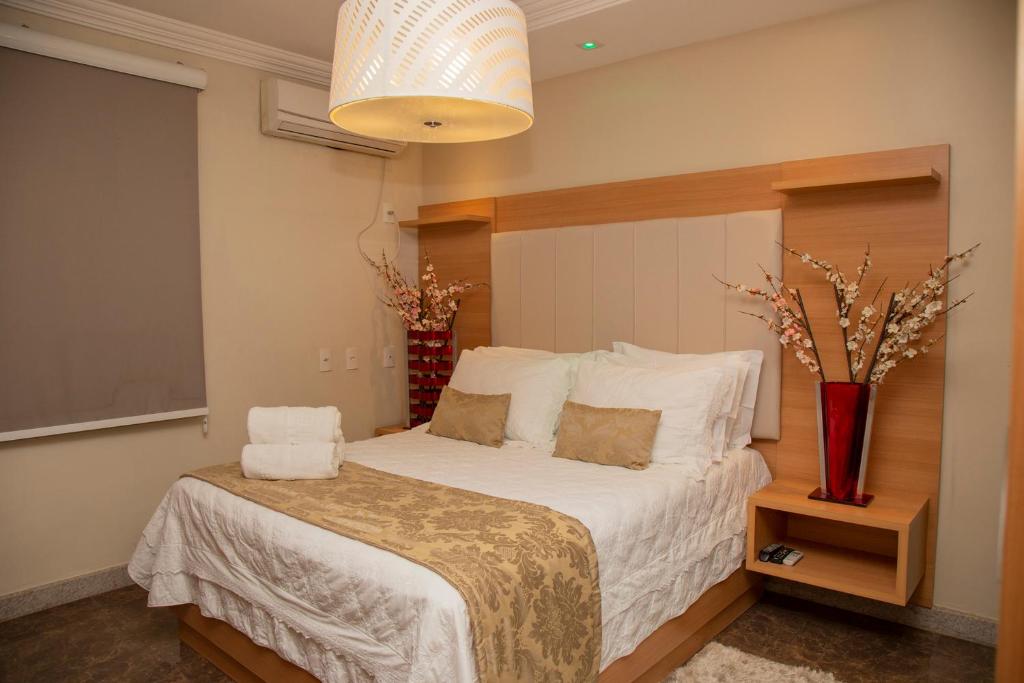 Posteľ alebo postele v izbe v ubytovaní Hotel Cravo e Canela