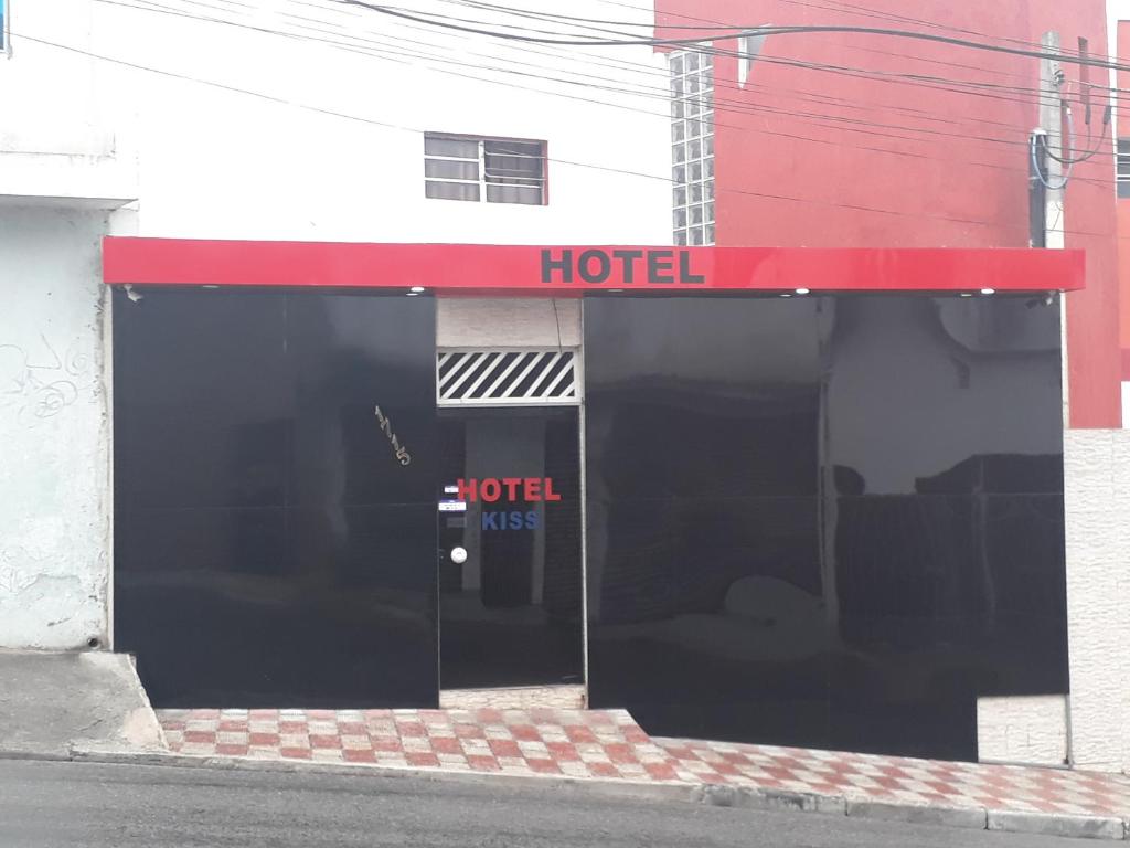 a building with a hotel sign on the door at HOTEL KISS - TABOÃO DA SERRA in Taboão da Serra