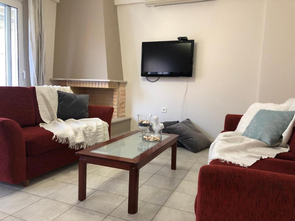 TV a/nebo společenská místnost v ubytování Zoi Apartment