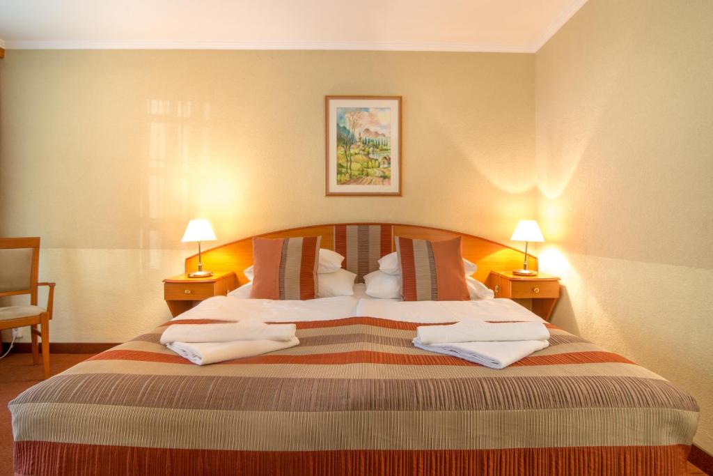 Łóżko lub łóżka w pokoju w obiekcie Hotel Spa Hévíz