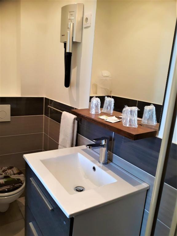 Koupelna v ubytování Hôtel Trianon