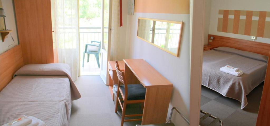 Postel nebo postele na pokoji v ubytování Albergo Al Pescatore