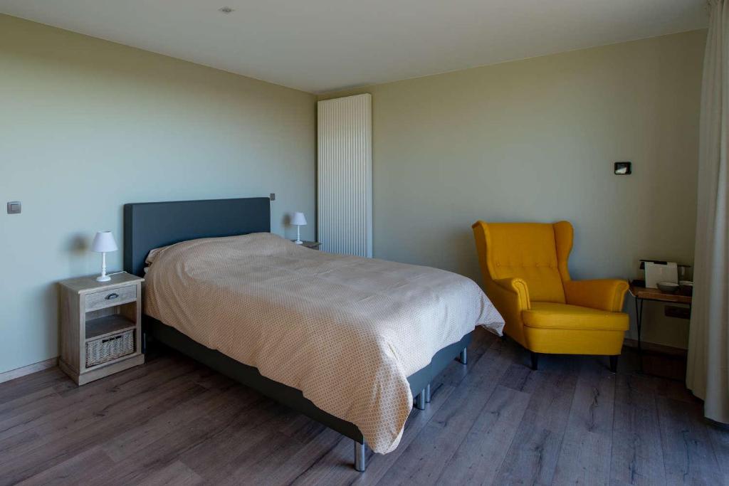 Postel nebo postele na pokoji v ubytování B&B 't Oezent
