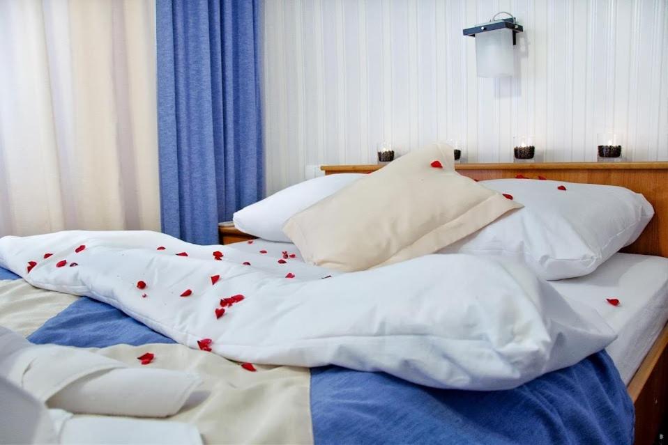 Łóżko lub łóżka w pokoju w obiekcie Vistula Hotel