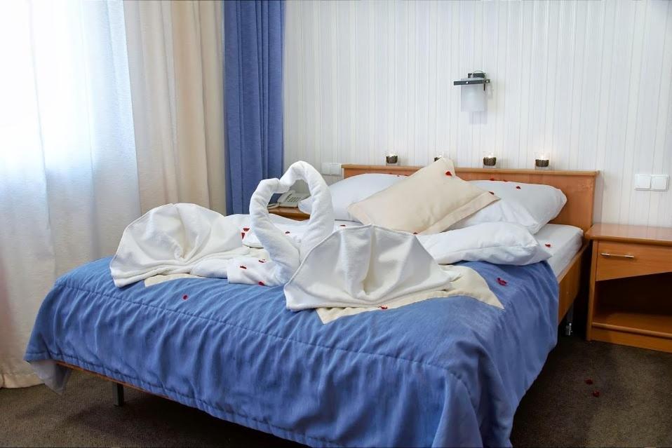 Łóżko lub łóżka w pokoju w obiekcie Vistula Hotel