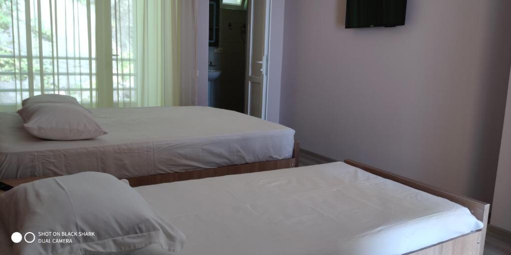 Postel nebo postele na pokoji v ubytování Guest House Palma