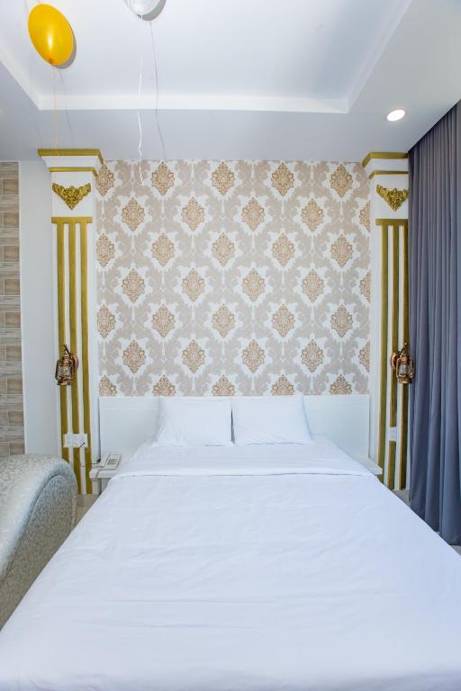 Postel nebo postele na pokoji v ubytování Romely Hotel Nha Trang