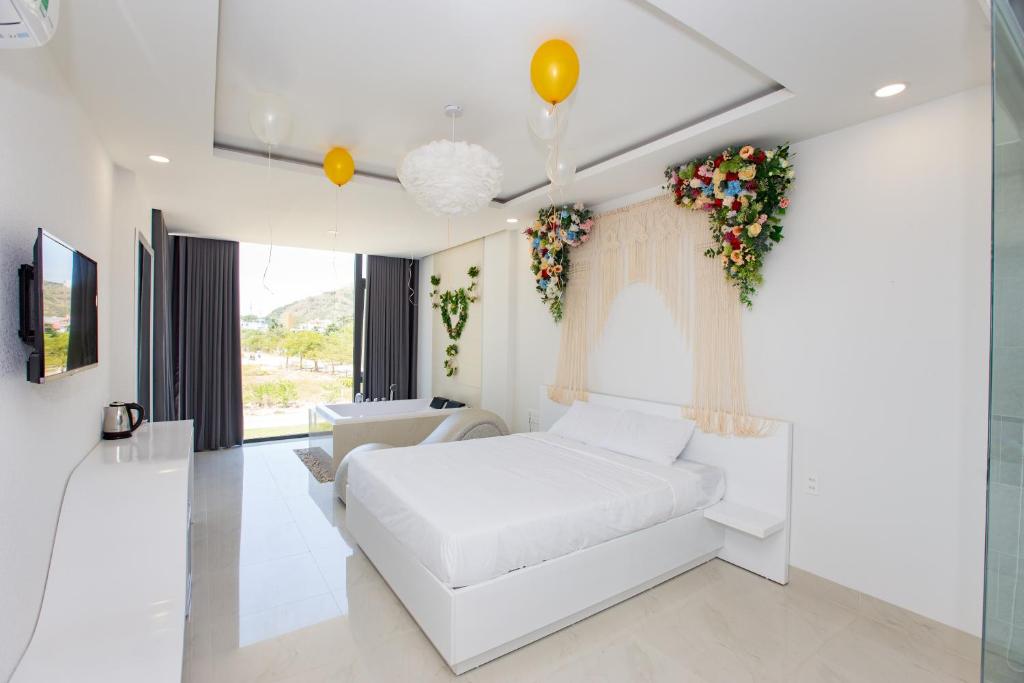 Postel nebo postele na pokoji v ubytování Romely Hotel Nha Trang