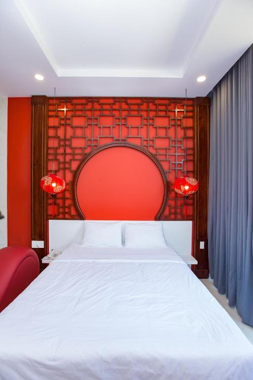 Postel nebo postele na pokoji v ubytování Romely Hotel Nha Trang