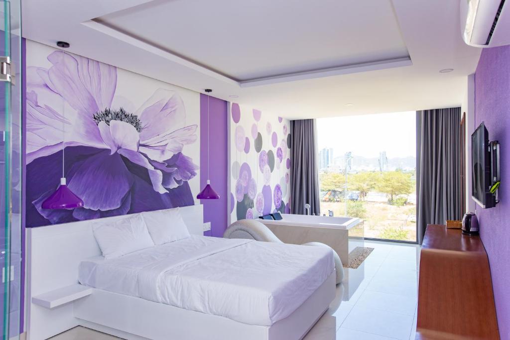 Postel nebo postele na pokoji v ubytování Romely Hotel Nha Trang