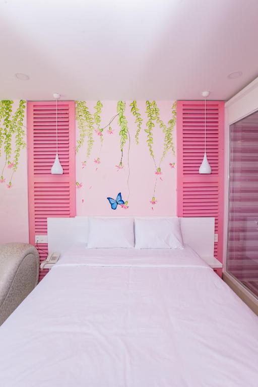 Postel nebo postele na pokoji v ubytování Romely Hotel Nha Trang