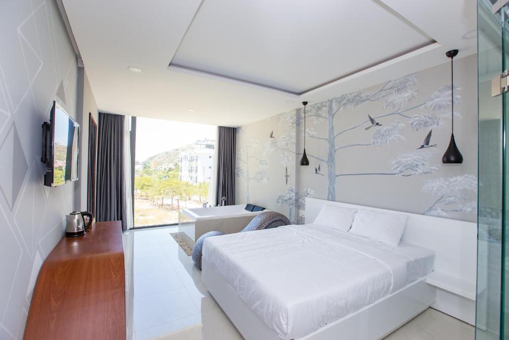 Postel nebo postele na pokoji v ubytování Romely Hotel Nha Trang
