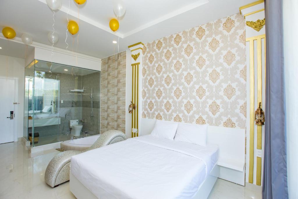 Postel nebo postele na pokoji v ubytování Romely Hotel Nha Trang