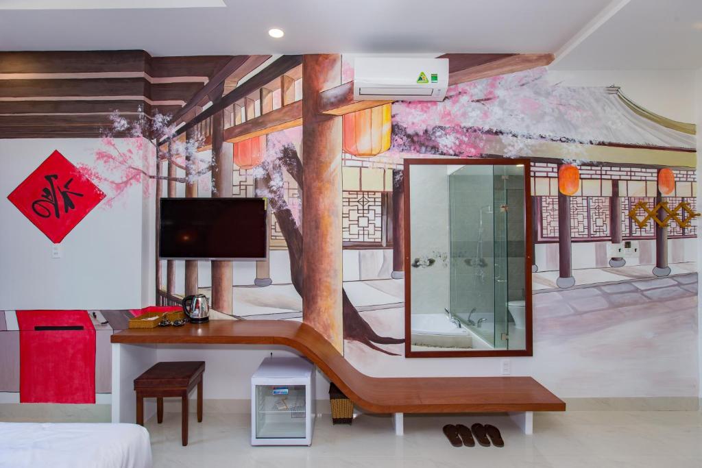 TV a/nebo společenská místnost v ubytování Romely Hotel Nha Trang