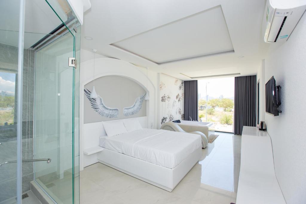 Postel nebo postele na pokoji v ubytování Romely Hotel Nha Trang