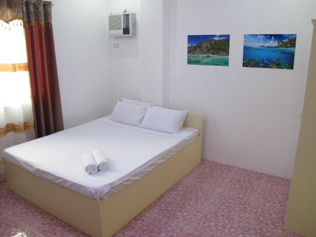 Postel nebo postele na pokoji v ubytování Cool Stay Inn