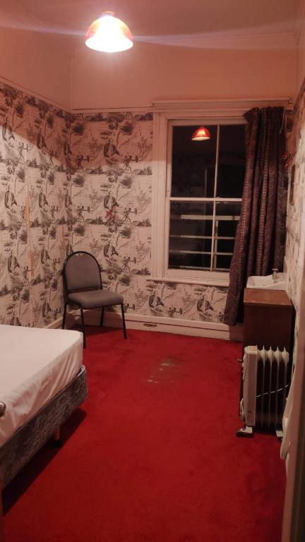 Postel nebo postele na pokoji v ubytování South Rakaia Hotel