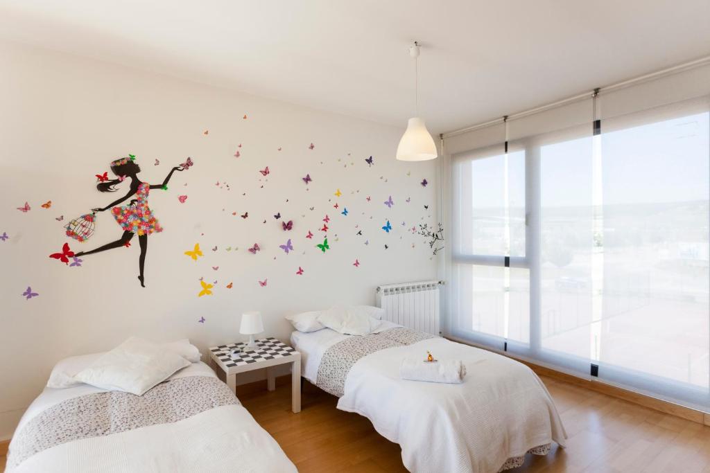 Postel nebo postele na pokoji v ubytování Tu hogar en Burgos