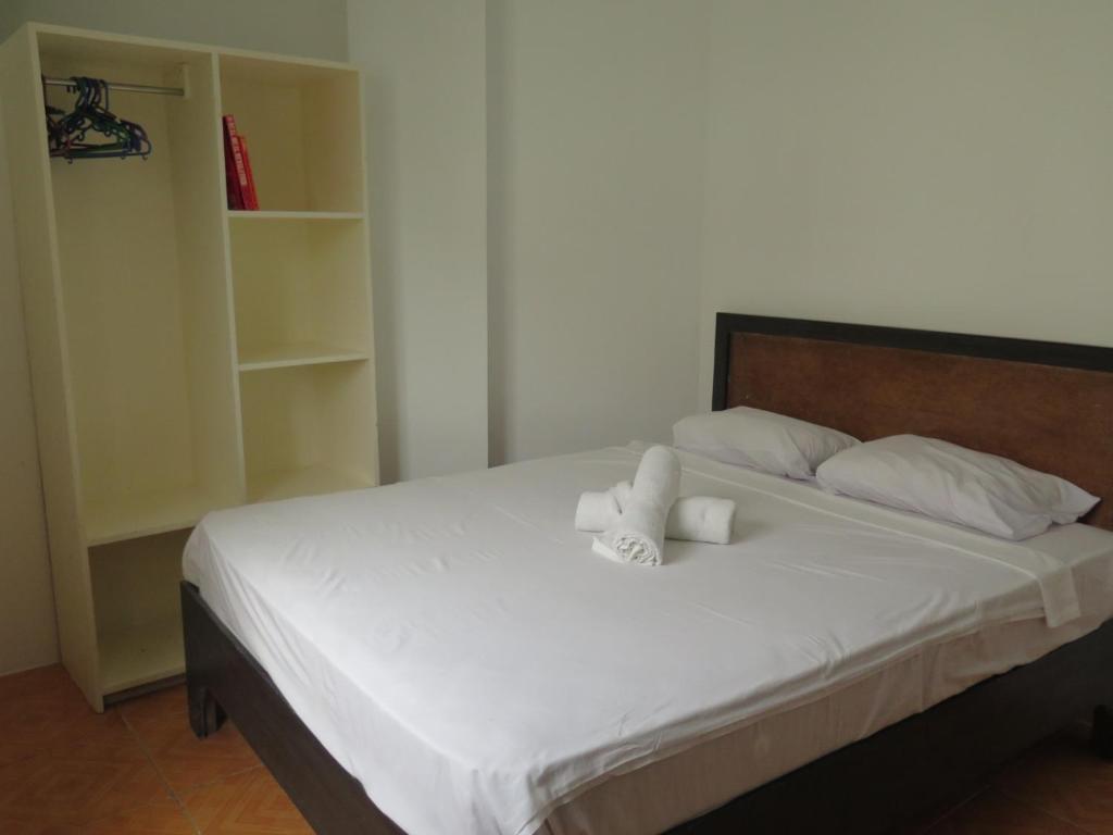Postel nebo postele na pokoji v ubytování Cool Stay Inn
