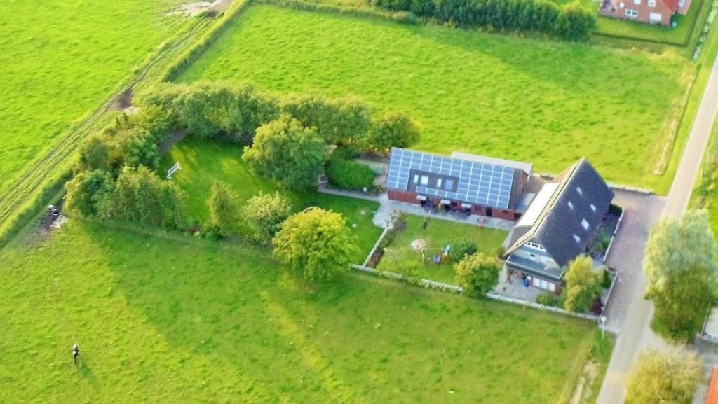 an aerial view of a house in a field at Landhaus Familie Allgeier in Holtgast